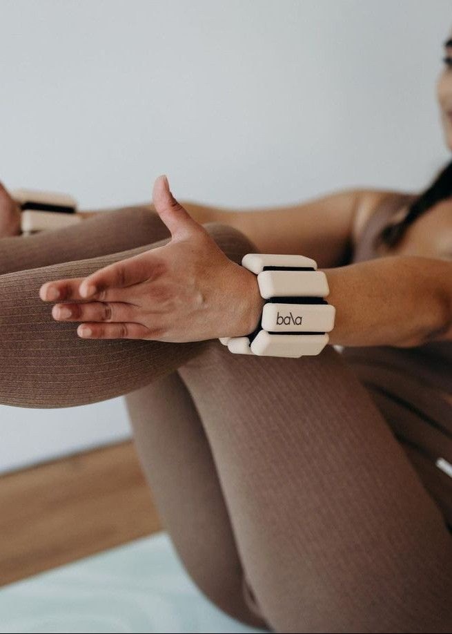 Wrist weights on crossed arms